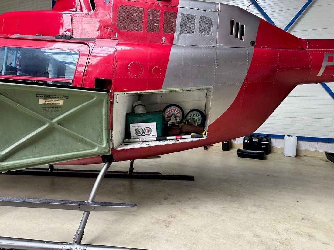 Easy Wheels stowed in a Bell 206 baggage bay