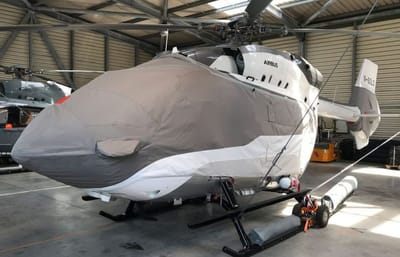 An H145 in a grey Air Covers cabin and hull cover