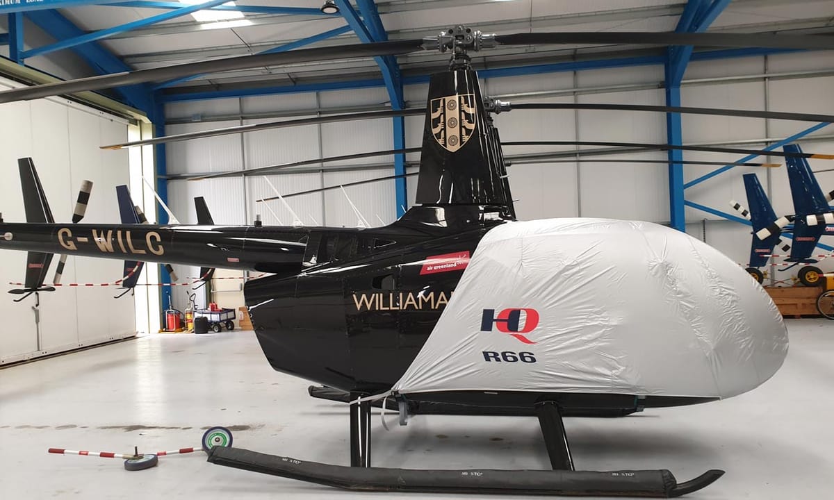 HQ-branded grey Air Covers cabin cover on a Robinson R66