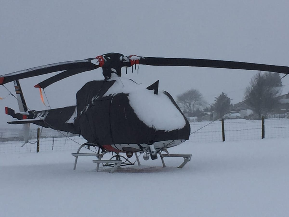 Airbus H125 under a full Air Covers set in snow