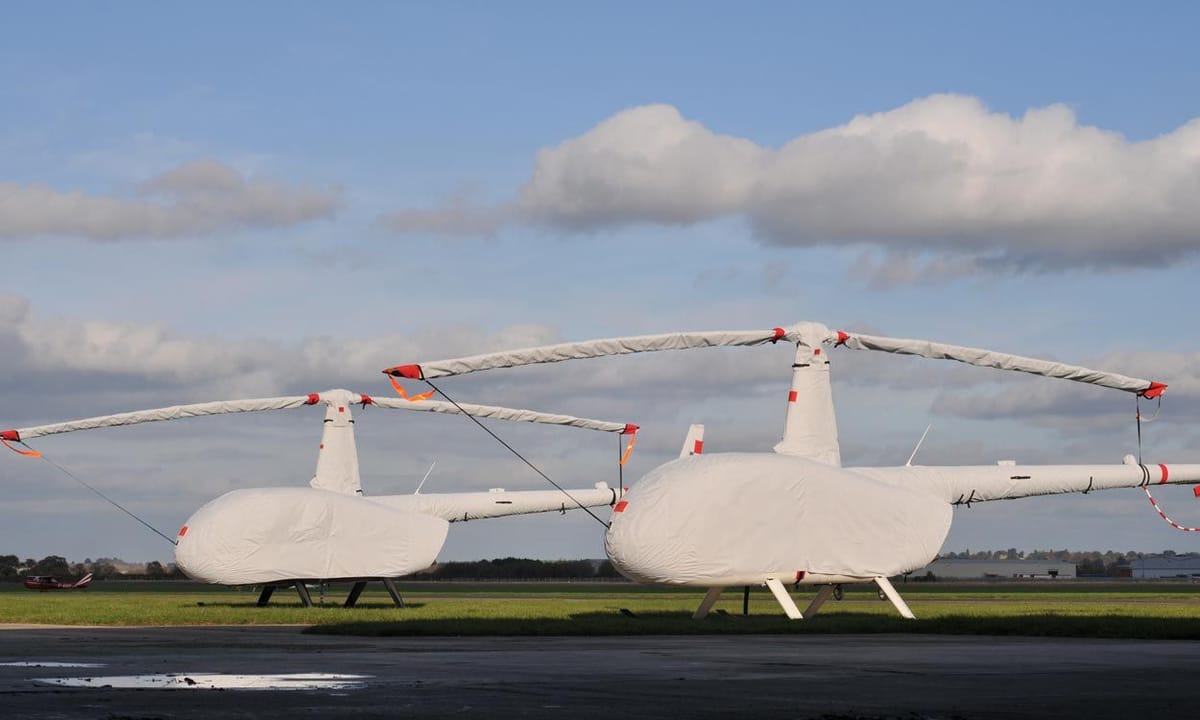 Two Robinson R44s in white Air Covers full sets with blade sleeves