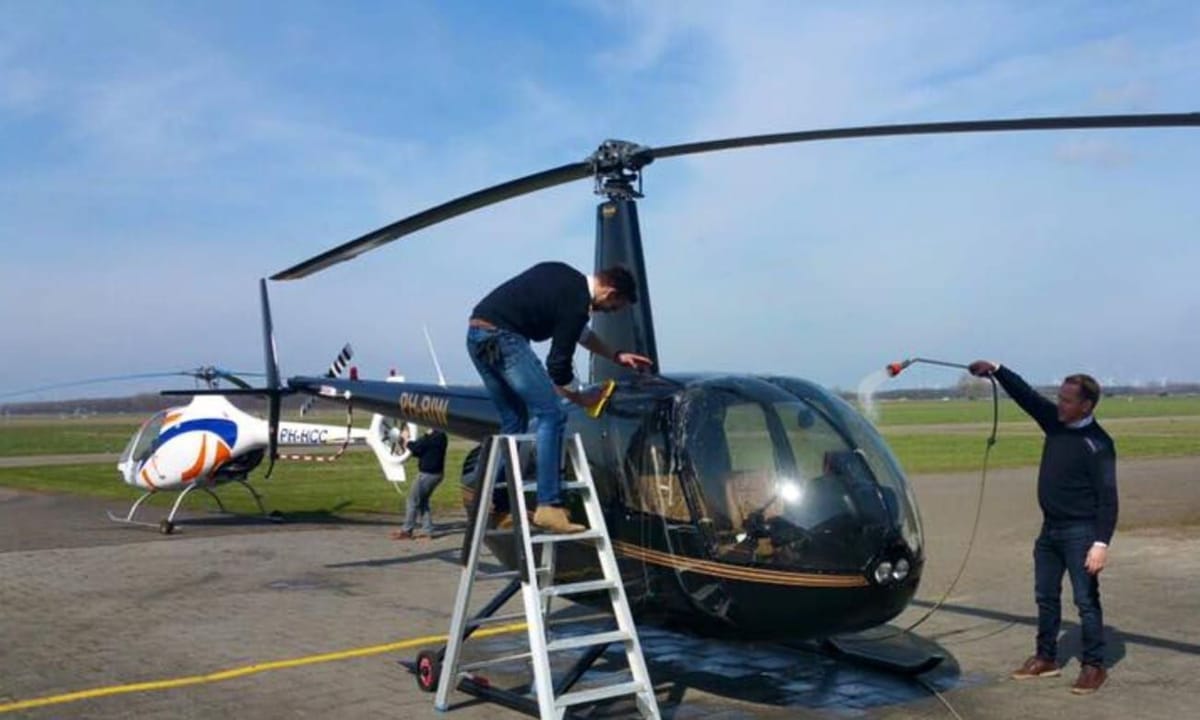 Robinson R44 raised on Easy Wheels on the apron