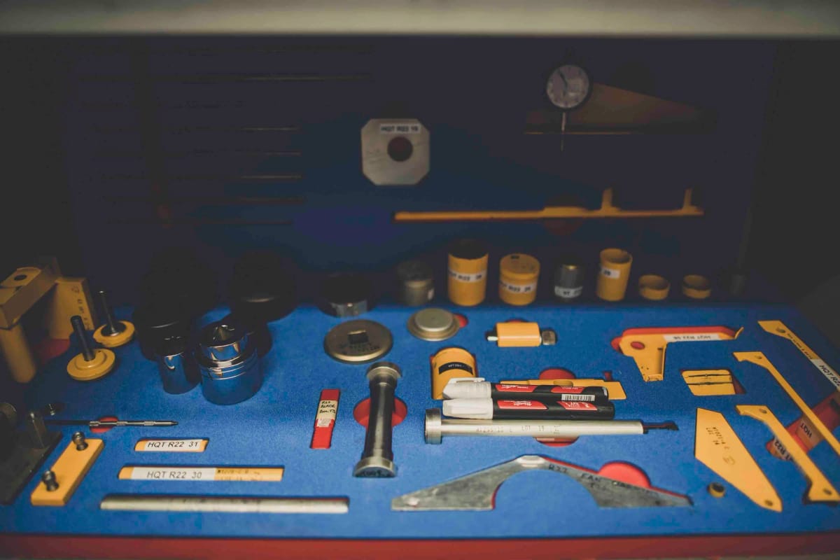 Precision maintenance tools laid out in a foam-lined tool drawer