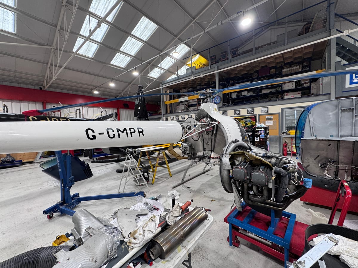 Robinson helicopter stripped for maintenance in the HQ Aviation workshop