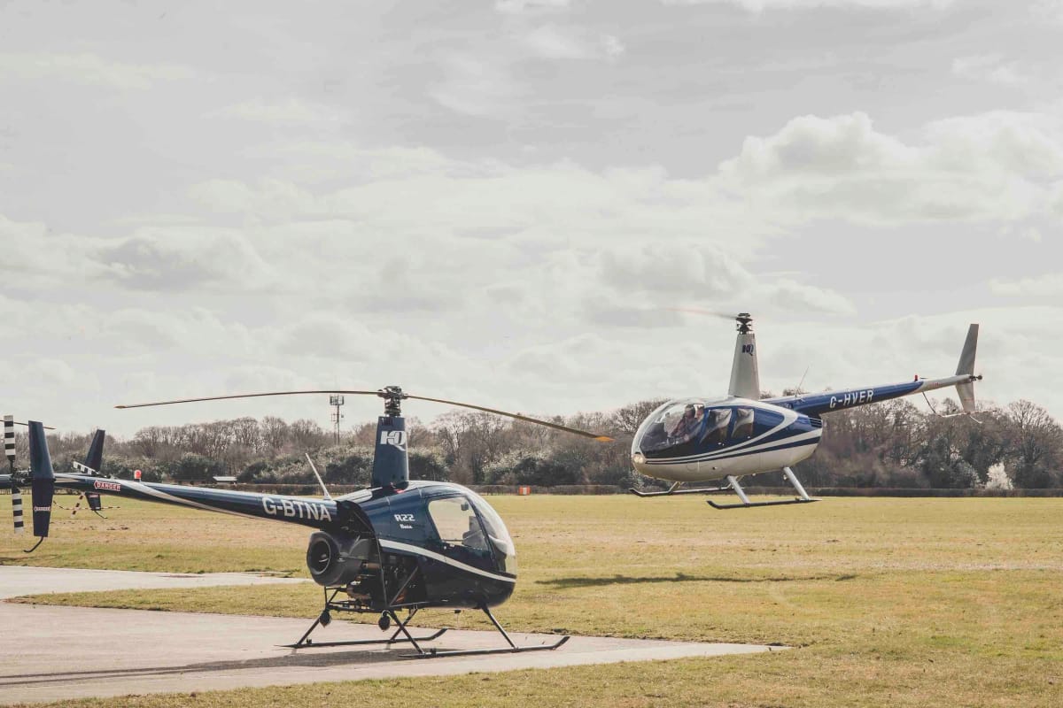 Robinson helicopters on the apron at Denham Aerodrome, home of HQ Aviation