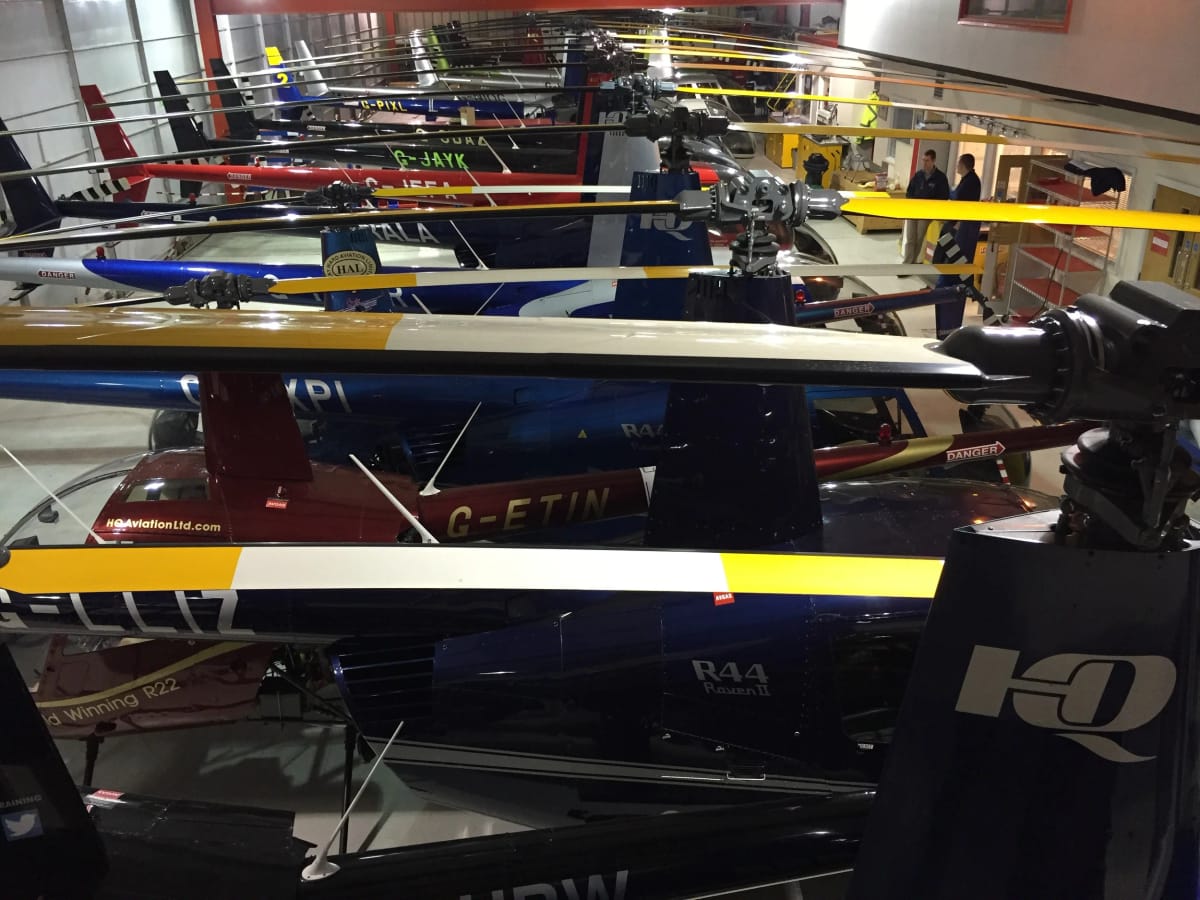 Robinson helicopters stored inside the HQ Aviation hangar at Denham Aerodrome